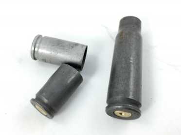 One of the first steps during inspection is to toss cases that are not made of brass. They're generally not reloadable.