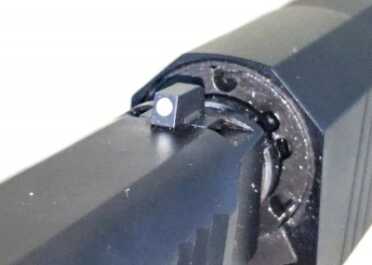 The standard sights weren't tall enough to clear any of the three suppressors I used. 