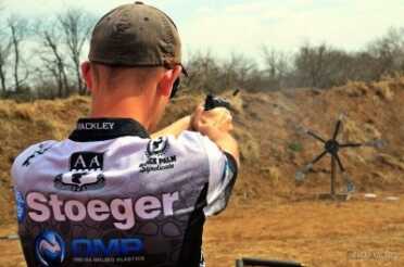 Tim Yackley, shooting USPSA Limited gun and shooting a Texas star.