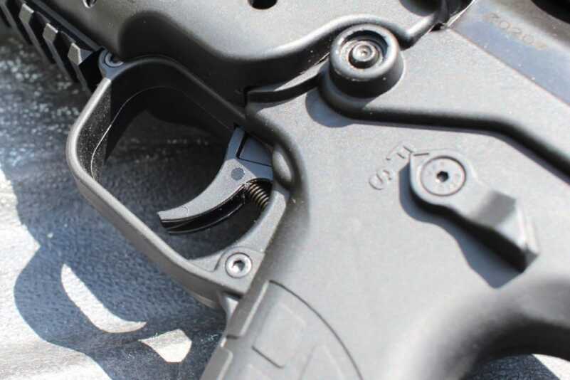 The trigger's return spring is exposed. This is the one obvious point of concern for me, as an exposed spring picks up grit and grime. It also clears it out, too. I had no issues with it.