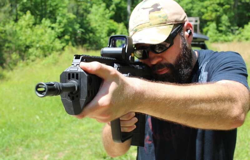 The 5.56mm Tavor X95 from IWI US takes the bullpup concept to the next level. Adam Garrison of HTC (High Threat Concealment) is shown here familiarizing himself with the X95. 
