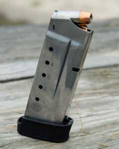 The pistol comes with two mags. The flush mag holds 6 and the extended carries 7.