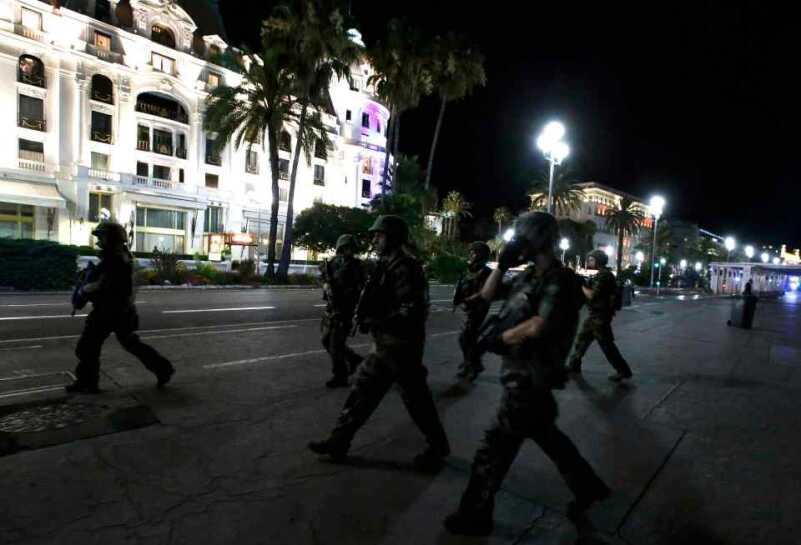 Bastille Day Celebration Turns to Massacre in Devastating Truck Attack French soldiers advance on the street after at least 30 people were killed in Nice, France, when a truck ran into a crowd celebrating the Bastille Day national holiday July 14, 2016. REUTERS/Eric Gaillard