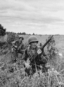 An Army sniper and his observer clearing an area on Luzon, in the Philippines in 1945. U.S. Army Photo.