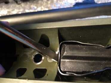 Then I used the same flathead to pry up from the front of the magazine. 