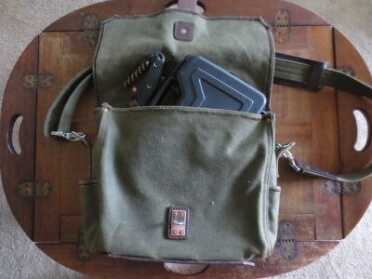 You can see the small outside pocket near the bottom of the bag. There's two of these on the inside as well. 