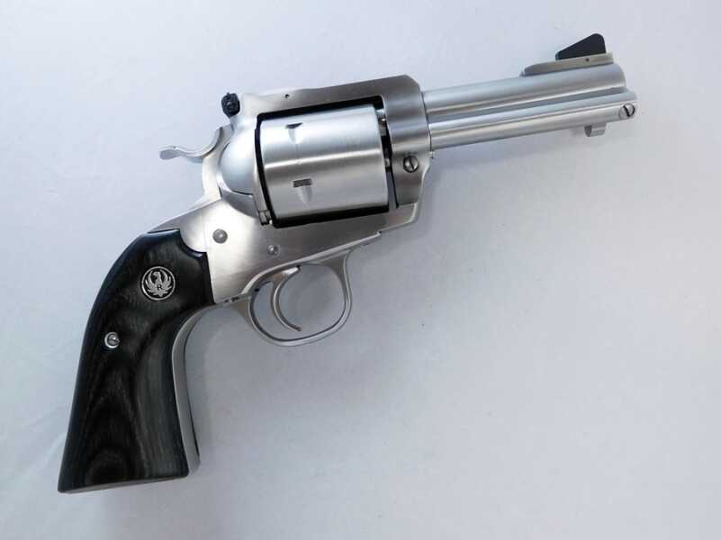 You can tell a Bisely by the sharper bend of the grip and the lowered hammer spur. The trigger guard is also a little more rounded. 