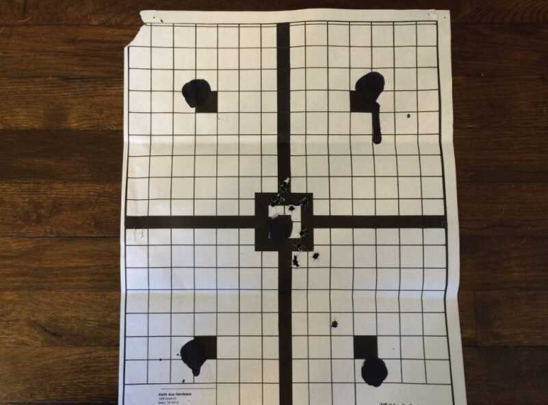 My hits are a little tough to see, but all of them except one were within a four inch diameter in the middle of the target. (Distance: Seven yards). 
