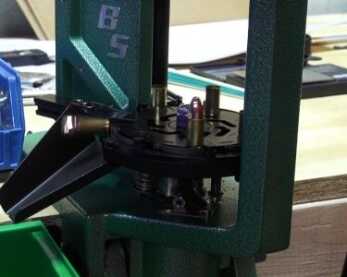 RCBS Pro-Chucker 7: Part 1 – Setup and First Operation The first round of 9mm falls from the shell plate.