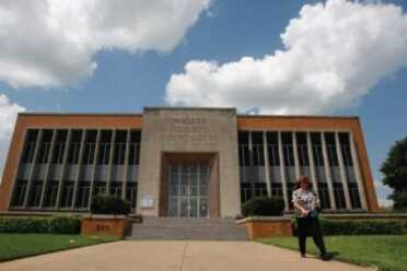Texas AG Sues a Houston County to Allow Concealed Firearms on Courthouse Premises (Photo: Julio Cortez, Houston Chronicle)