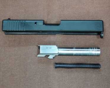 A .50-Caliber Glock? Full Review: Conversion Kit & Complete Gun The components are basic and familiar. The spring is a 24-lb. flat-wire type for maximum recoil management.