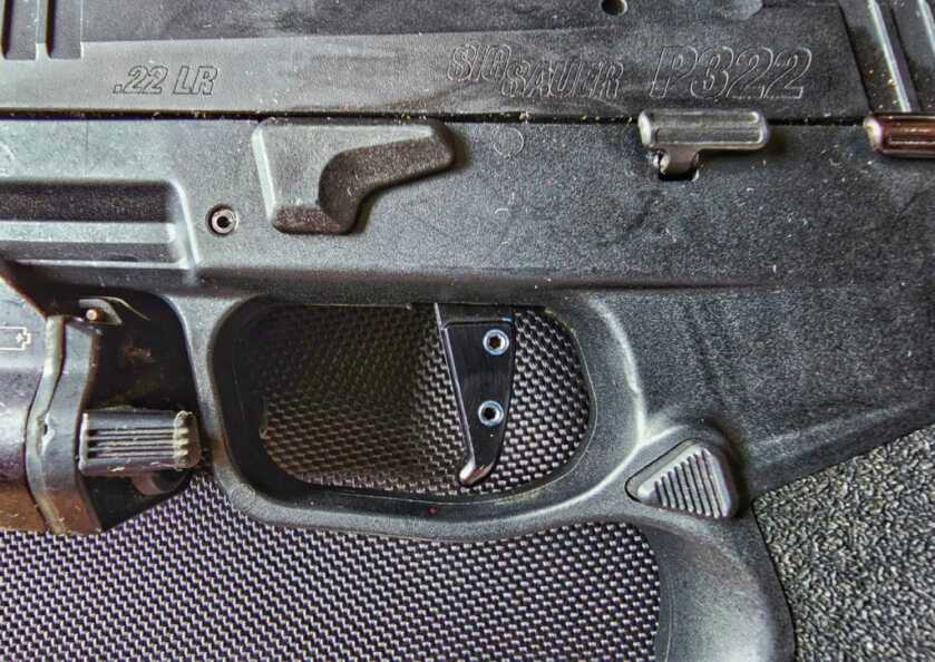 Top Accessories for the SIG Sauer P322 in 2023 Armory Craft P322 installed in the SIG P322 pistol side view of the installation screws