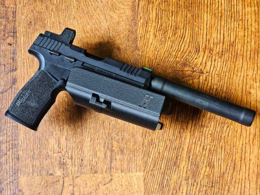 Top Accessories for the SIG Sauer P322 in 2023 Hush Holsters Thumb Drive Retention Holster shown with SIG Suppressor right side.