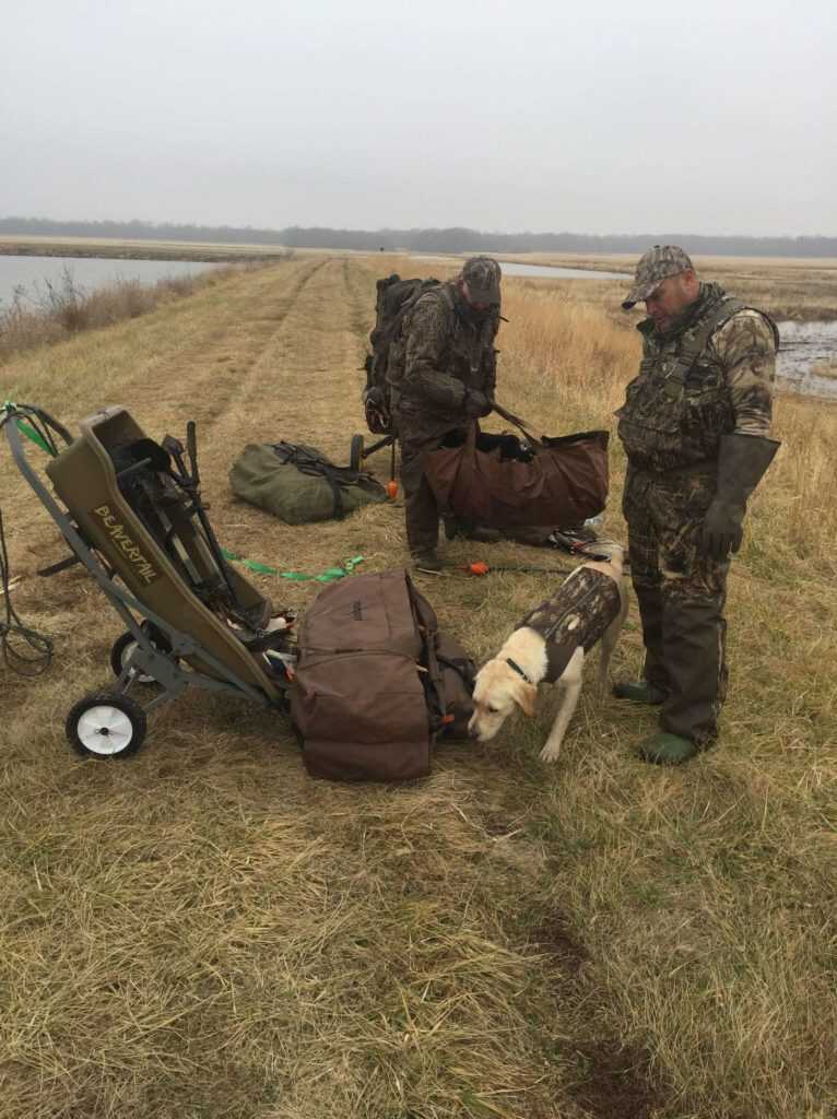 2 - Hunt365 - Carry or Haul Hunters and dog preparing for a hike