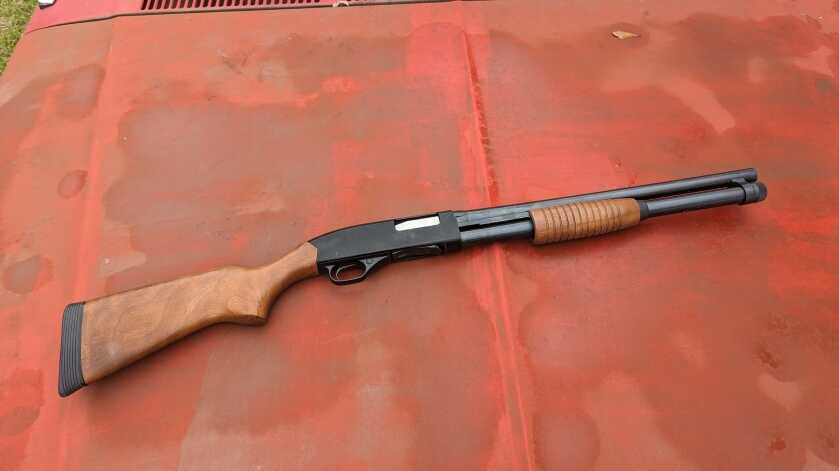 The Winchester 1300 Defender - Pump Action Perfection Winchester 1300 Defender series shotgun against orange vintage-style backdrop