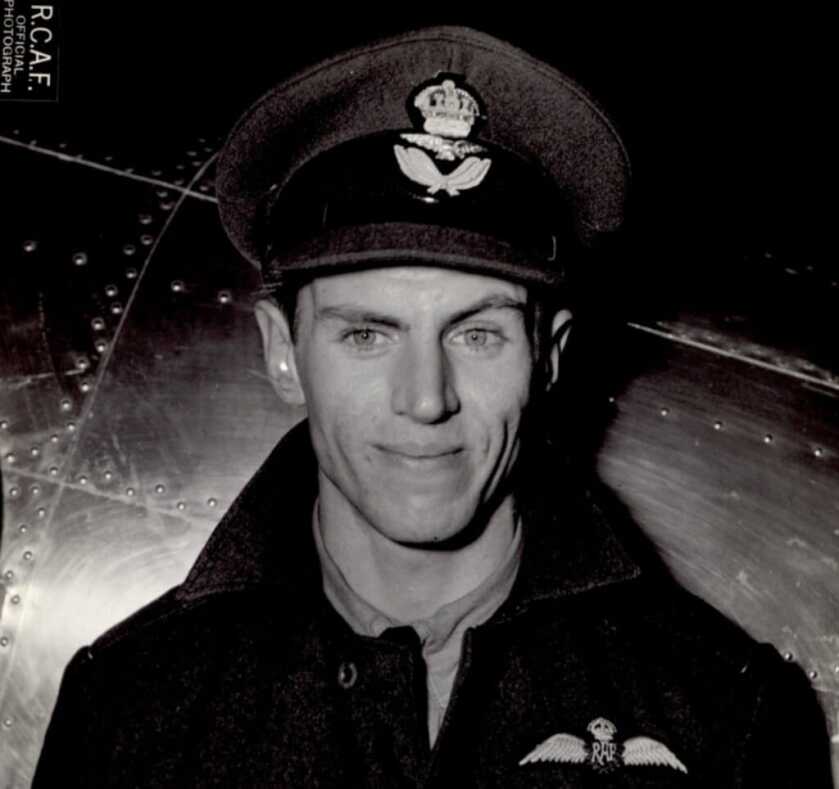 George Beurling in front of airplane