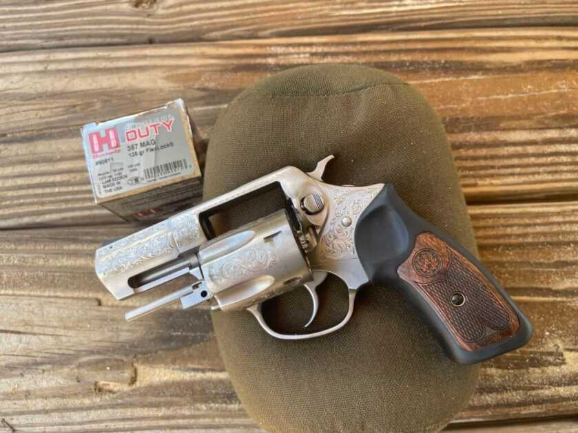 The TALO SP101 with Hornady ammunition on a wooden table