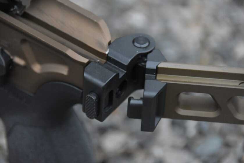 Closeup view of the folding hinge on a folding stock.