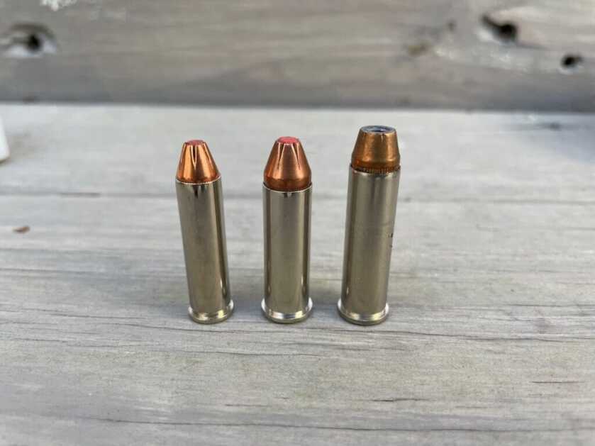 3 revolver bullets on wood table