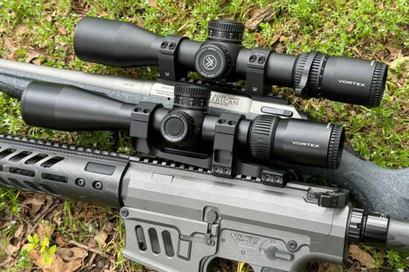 A rifle and a shotgun with Vortex scopes installed on them