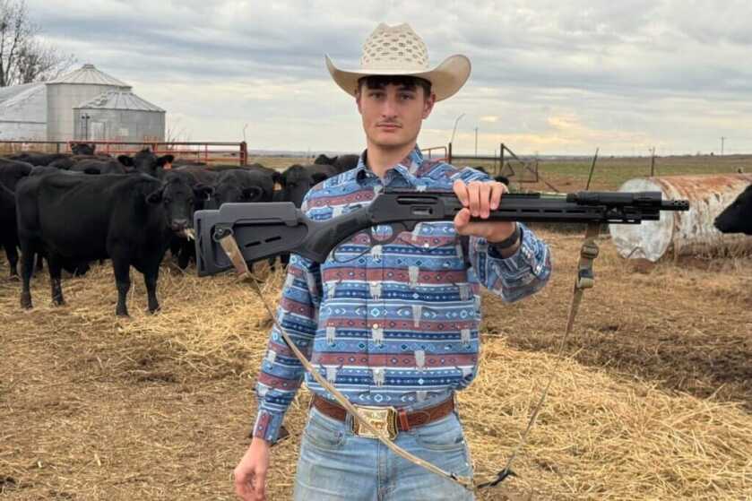 Cowboy holding the Marlin Dark Series Model 1895