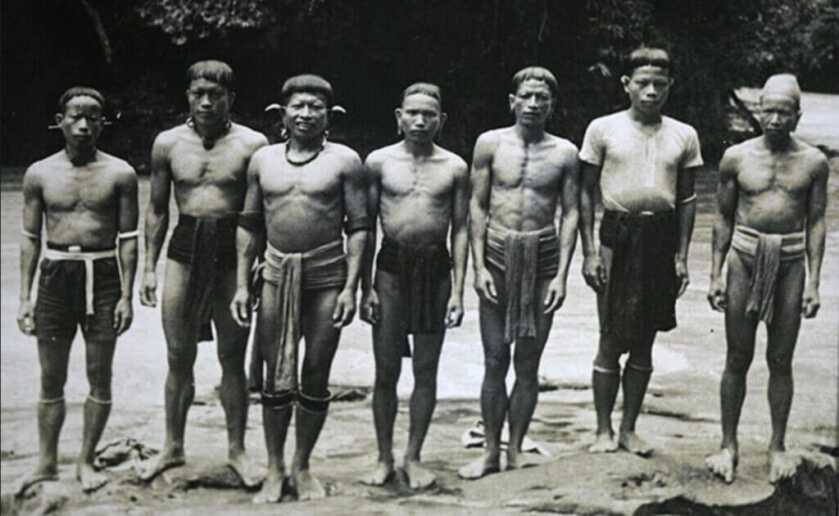 Indigenous men in a line