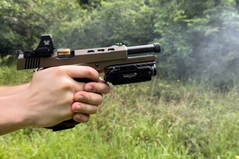 Stealth Arms Platypus handgun firing while Vortex Defender-XL red dot is mounted on top