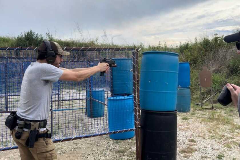 Man at USPSA match shooting the S&W M2.0 Carry Comp pistol