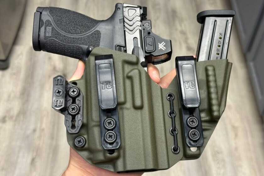 Smith & Wesson M2.0 Carry Comp holstered with extra magazine