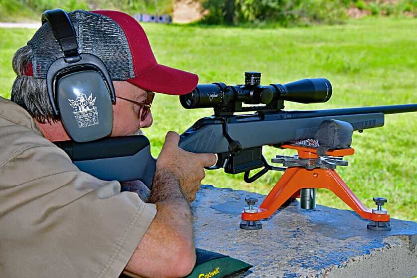 Man with hearing protection Colt CBX TAC Hunter rifle