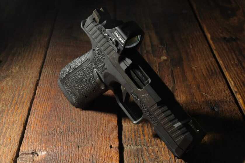 The Archon Gen 2, Type B is posed standing on a wooden table. 