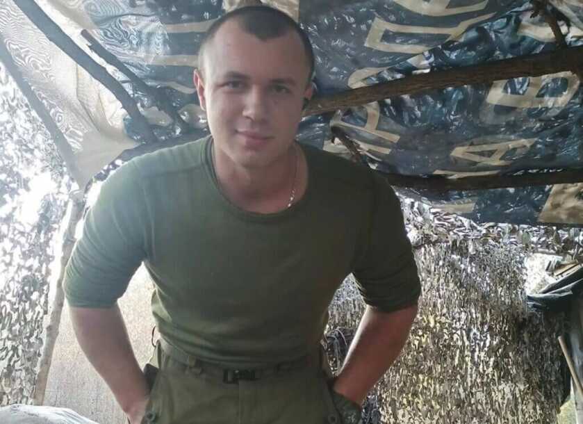 Vitalii wearing fatigues in military tent