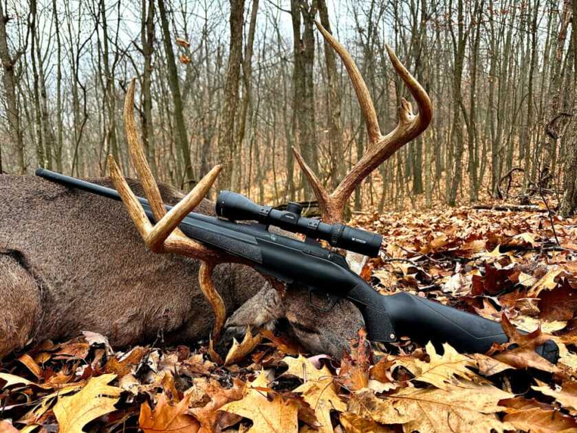 The author's Winchester XPR chambered in 400 legend, along with the drop-tine buck featured in the article.