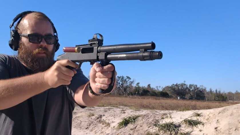 man aiming compact cruiser