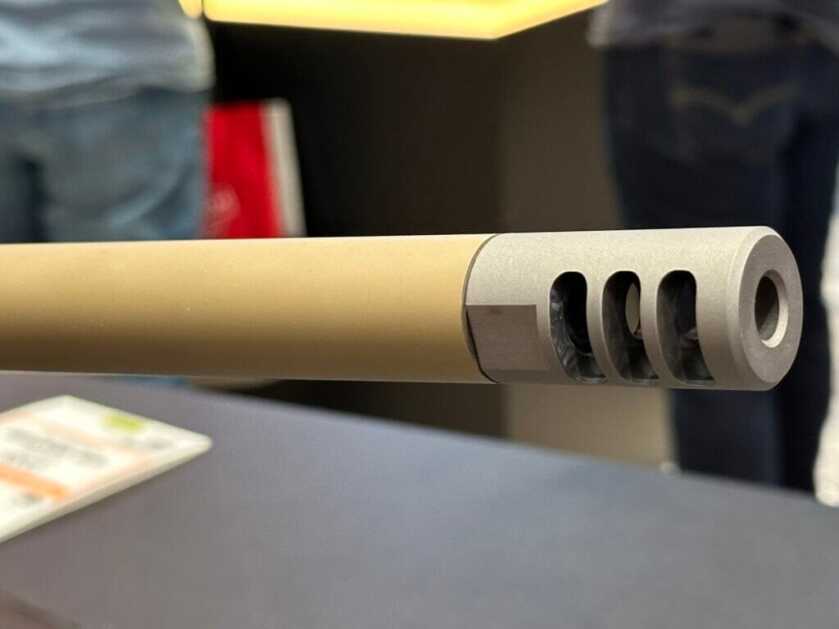 A closeup look at the end of the rifle shows an aggressive muzzle brake.