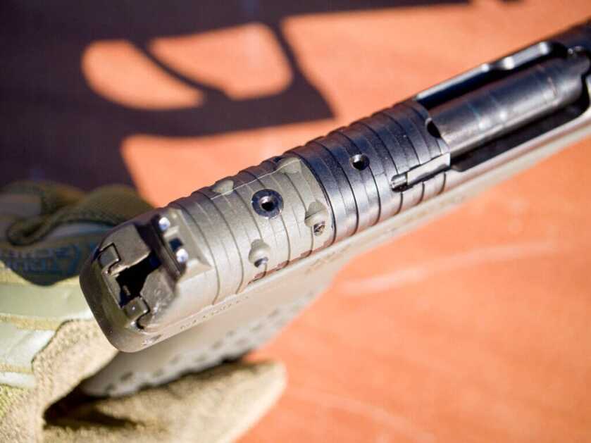 Top of the back of the slide. The back portion is changeable for optics compatibility. The sights are fixed.