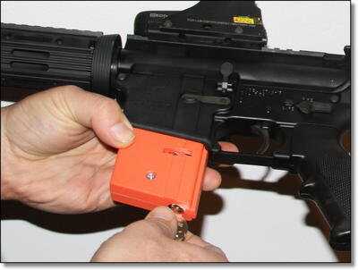 The locking bar from the AR MagVault fits into the magazine release on your AR-15, creating what is most likely an inpenetrable gunlock. The locking bar from the AR MagVault fits into the magazine release on your AR-15, creating what is most likely an inpenetrable gunlock.