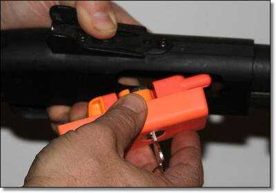 Inserting the BreechVault into a Mossberg 590. Inserting the BreechVault into a Mossberg 590.