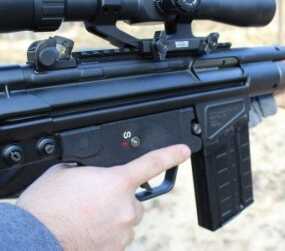 The safety indicator is clearly visible from the right side of the receiver.