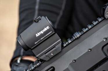 Aimpoint Micro H-1 Review Side view of Aimpoint H-1 in Aimpoint High Mount