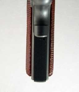 The backstrap or main spring housing, and grips, have nice checkering.