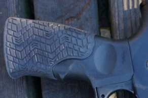 The grip has the same padded rubber as the stock and the fore grip.  