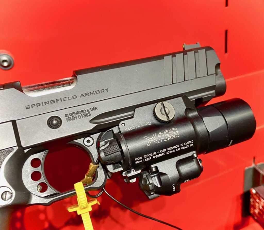 weapon light pressure switch and controls accessible for momentary and constant modes
