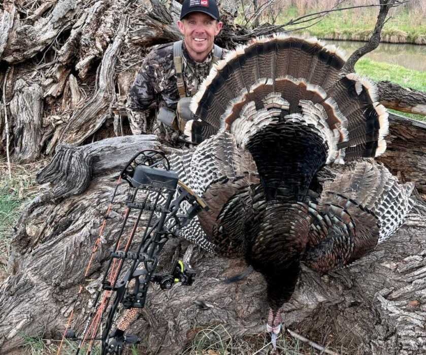man with a dead turkey
