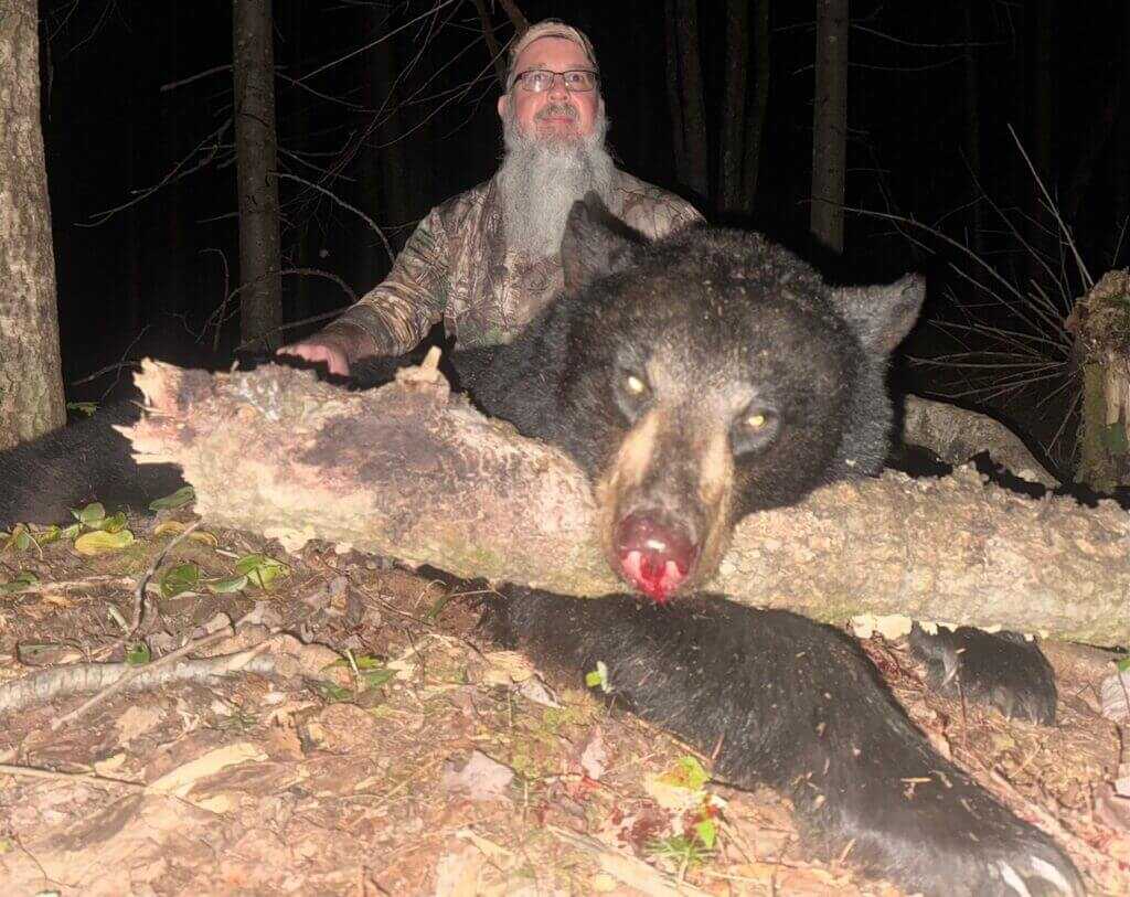 Hunter with Maine black bear taken using a 454 Casull and 265gr Swift A Frame