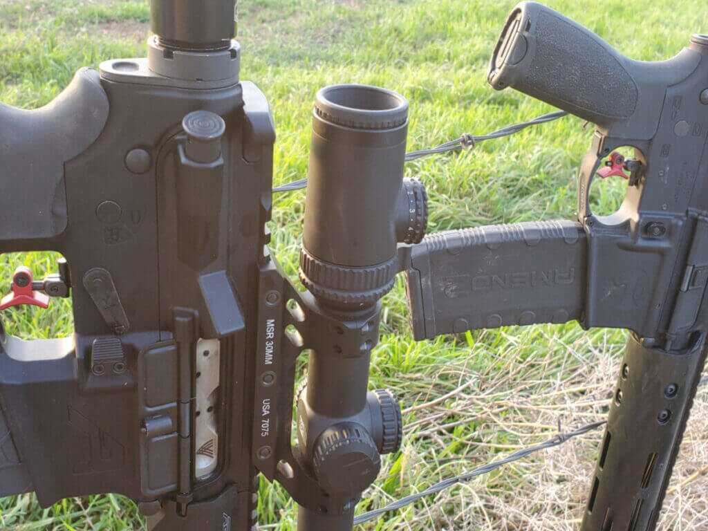 AR platform rifles set up for hunting use in the field