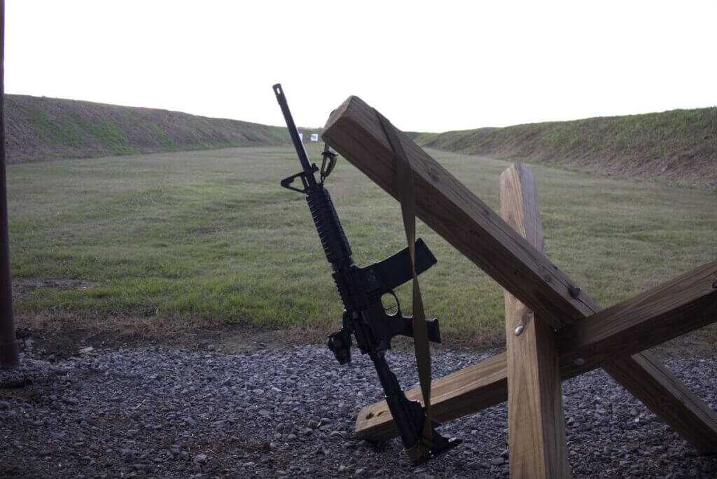 Smith and Wesson M&P Sport II mounted with Primary Arms SLx 3x prism sight at the shooting line