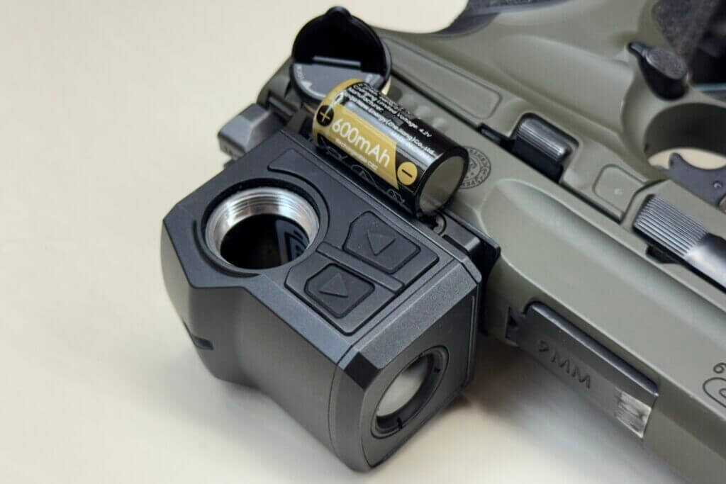 CR2 battery installed in the Infitac FML19 with battery door open