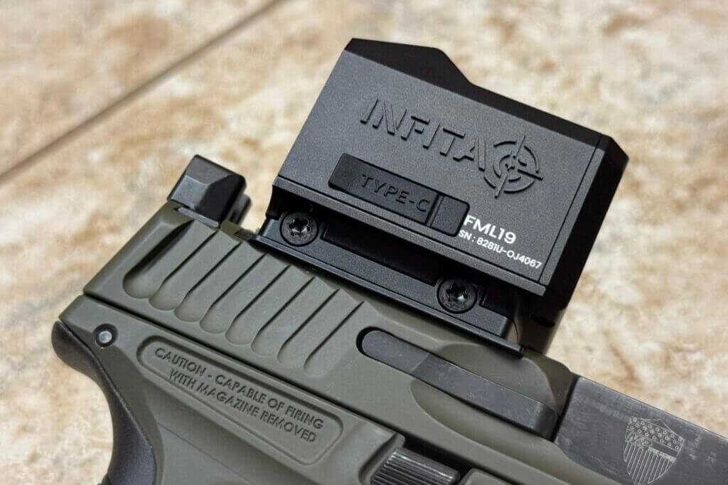 Right-side view of Infitac FML19 housing showing USB-C charging port and 7075 aluminum body