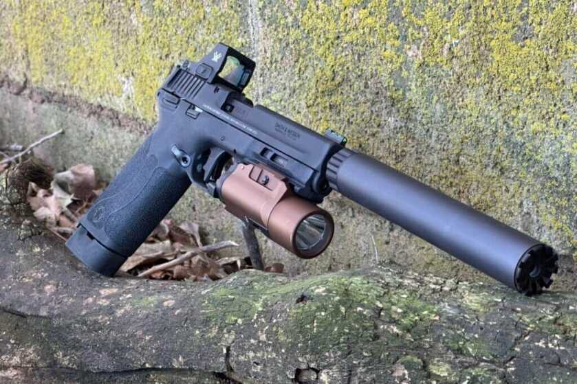 Smith & Wesson M&P22X rimfire pistol with optic ready slide and threaded barrel shown on bench